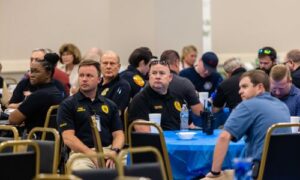 Two chiefs sitting at table photo